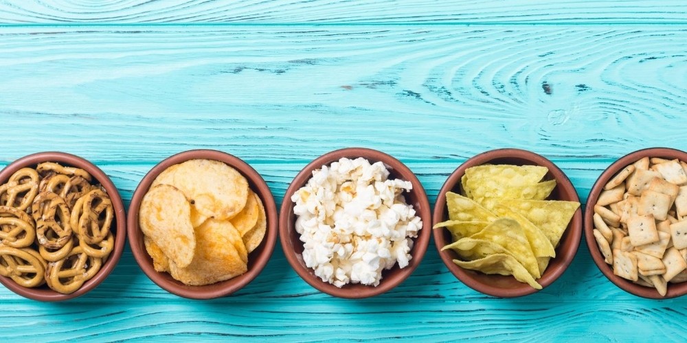 various snacks in bowls